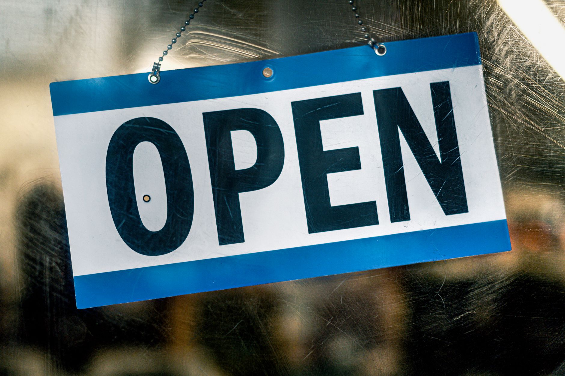Local restaurant storefront with an open sign